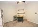 Home office with a desk and shelving at 13558 W Saguaro Ln, Surprise, AZ 85374