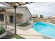 Relaxing patio space near the pool and outdoor kitchen at 13558 W Saguaro Ln, Surprise, AZ 85374