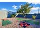 Spacious backyard with lawn games and a tree at 13801 N 57Th St, Scottsdale, AZ 85254