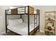 Small bedroom with a full-size bed and a wooden bookcase at 13801 N 57Th St, Scottsdale, AZ 85254