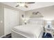 Cozy bedroom with a full-size bed and a white wooden frame at 13801 N 57Th St, Scottsdale, AZ 85254