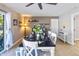 Spacious dining room with a dark wooden table, white chairs, and a built-in bench at 13801 N 57Th St, Scottsdale, AZ 85254