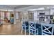 Modern kitchen with stainless steel appliances and a breakfast bar with seating at 13801 N 57Th St, Scottsdale, AZ 85254