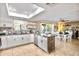 Spacious kitchen with island, stainless steel appliances, and dining area at 13801 N 57Th St, Scottsdale, AZ 85254