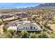 Aerial view of a house with desert landscape at 13814 E Yolantha St, Scottsdale, AZ 85262