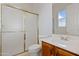 Clean bathroom with a shower/tub combo and wood vanity at 13814 E Yolantha St, Scottsdale, AZ 85262