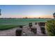 Landscaped backyard with gorgeous sunset and golf course views at 1401 E Sweet Citrus Dr, Queen Creek, AZ 85140