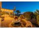 Outdoor patio with pergola, fire pit, and built-in grill at 1401 E Sweet Citrus Dr, Queen Creek, AZ 85140