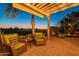 Relaxing patio with fire pit and golf course view at 1401 E Sweet Citrus Dr, Queen Creek, AZ 85140