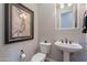 Small bathroom with pedestal sink and toilet at 1401 E Sweet Citrus Dr, Queen Creek, AZ 85140