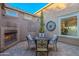 Private courtyard with fireplace and seating area at 1401 E Sweet Citrus Dr, Queen Creek, AZ 85140