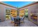 Private courtyard with seating area and fireplace, adjacent to kitchen at 1401 E Sweet Citrus Dr, Queen Creek, AZ 85140