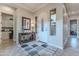 Elegant entryway with wood console table and decorative mirror at 1401 E Sweet Citrus Dr, Queen Creek, AZ 85140