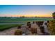 Scenic view of a lush green golf course at sunset at 1401 E Sweet Citrus Dr, Queen Creek, AZ 85140