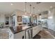 Modern kitchen with island, stainless steel appliances, and views to the backyard at 1401 E Sweet Citrus Dr, Queen Creek, AZ 85140