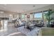 Bright living room with tile floors, comfy sofas, and views to golf course at 1401 E Sweet Citrus Dr, Queen Creek, AZ 85140