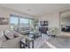 Bright living room with large windows and comfortable seating at 1401 E Sweet Citrus Dr, Queen Creek, AZ 85140