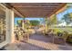 Outdoor kitchen and patio furniture under a pergola at 1401 E Sweet Citrus Dr, Queen Creek, AZ 85140