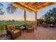 Relaxing patio with fire pit and seating area, overlooking golf course at 1401 E Sweet Citrus Dr, Queen Creek, AZ 85140