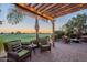 Relaxing patio with fire pit and stunning golf course views at 1401 E Sweet Citrus Dr, Queen Creek, AZ 85140