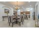 Elegant dining area with a chandelier, views of the kitchen, and ample seating for Gathering and guests at 1416 E Artemis Trl, Queen Creek, AZ 85140