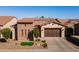 Charming single-story home with a well-manicured front yard and a two-car garage at 1416 E Artemis Trl, Queen Creek, AZ 85140