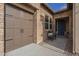 Exterior view featuring a brick facade, front entry, and garage at 1416 E Artemis Trl, Queen Creek, AZ 85140
