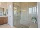 Bathroom shower boasts glass doors, bench, and a rain shower head at 1416 E Artemis Trl, Queen Creek, AZ 85140
