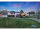 Beautiful landscaping surrounds this single story home at 14426 W Becker Ln, Surprise, AZ 85379