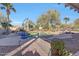 Inviting pool area with lounge chairs and landscaping at 14426 W Becker Ln, Surprise, AZ 85379