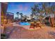 Inviting pool with patio furniture and desert landscaping at 14426 W Becker Ln, Surprise, AZ 85379