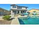 Relaxing backyard with a large pool, comfortable seating, and a covered patio at 14877 N 145Th Dr, Surprise, AZ 85379