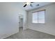Bedroom with ceiling fan, closet, and carpet at 14877 N 145Th Dr, Surprise, AZ 85379