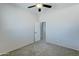 Bedroom with ceiling fan and carpet at 14877 N 145Th Dr, Surprise, AZ 85379