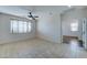 Bright and airy bedroom with ceiling fan and tile flooring at 14877 N 145Th Dr, Surprise, AZ 85379
