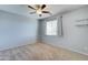 Bright bedroom with ceiling fan and carpet at 14877 N 145Th Dr, Surprise, AZ 85379
