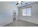 Bedroom with ceiling fan, closet, and carpet at 14877 N 145Th Dr, Surprise, AZ 85379