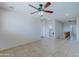 Spacious bonus room with tile flooring and ceiling fan at 14877 N 145Th Dr, Surprise, AZ 85379