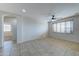 Bonus room with tile flooring, large window, and access to other rooms at 14877 N 145Th Dr, Surprise, AZ 85379