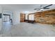 Dining room with wood-paneled accent wall and tile floor at 14877 N 145Th Dr, Surprise, AZ 85379