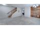 Entryway with staircase and view into living room at 14877 N 145Th Dr, Surprise, AZ 85379