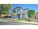 Two-story house with stone accents and landscaping at 14877 N 145Th Dr, Surprise, AZ 85379