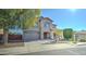 Two-story house with stone accents and a landscaped yard at 14877 N 145Th Dr, Surprise, AZ 85379