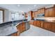 Large kitchen with granite counters, stainless steel appliances, and wood cabinetry at 14877 N 145Th Dr, Surprise, AZ 85379