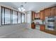 Bright kitchen with wood cabinets, granite counters and window at 14877 N 145Th Dr, Surprise, AZ 85379