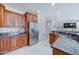 Kitchen boasts granite countertops, ample cabinetry, and stainless steel appliances at 14877 N 145Th Dr, Surprise, AZ 85379