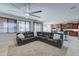 Spacious living room with sectional sofa and kitchen views at 14877 N 145Th Dr, Surprise, AZ 85379