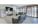Living room with sectional sofa, fireplace, and built-in shelving at 14877 N 145Th Dr, Surprise, AZ 85379