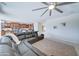 Living room with sectional sofa and access to kitchen at 14877 N 145Th Dr, Surprise, AZ 85379
