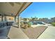 Inviting backyard oasis with a sparkling pool and covered patio at 14877 N 145Th Dr, Surprise, AZ 85379